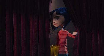 Movie still from “Coraline” (2009), directed by Henry Selick – A doll that is standing in front of a curtain; Medium shot, Over the shoulder angle
