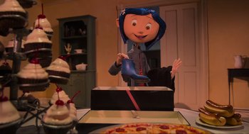 Movie still from “Coraline” (2009), directed by Henry Selick – A balloon of coraline in front of a box of pizza; Wide shot, Over the shoulder angle