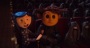 Movie still from “Coraline” (2009), directed by Henry Selick – A couple of people that are sitting in a theater; Medium shot, Over the shoulder angle