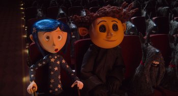 Movie still from “Coraline” (2009), directed by Henry Selick – A doll and a stuffed animal; Medium shot, Over the shoulder angle