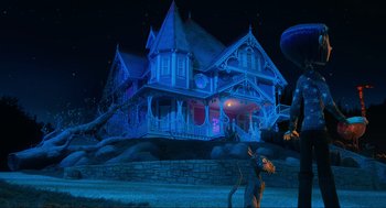 Movie still from “Coraline” (2009), directed by Henry Selick – A scooby - doo character is standing in front of a haunted house; Extreme Wide shot, Low angle