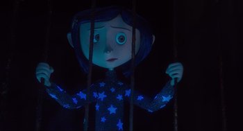 Movie still from “Coraline” (2009), directed by Henry Selick – A creepy doll with blue stars on it's body; Medium shot, Over the shoulder angle