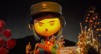 Movie still from “Coraline” (2009), directed by Henry Selick – The head of a cartoon character; Close Up shot, Over the shoulder angle