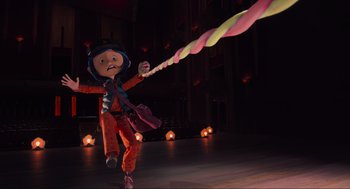 Movie still from “Coraline” (2009), directed by Henry Selick – A person is holding a rope in the dark; Wide shot, Low angle