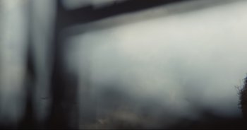 Movie still from “Cow” (2021), directed by Andrea Arnold – A blurry image of a car window with fog coming from the window; Extreme Close Up shot, Low angle