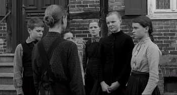 Movie still from “The White Ribbon” (2009), directed by Michael Haneke – Medium shot, Over the shoulder angle