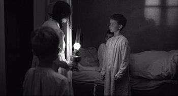 Movie still from “The White Ribbon” (2009), directed by Michael Haneke – Medium shot, Over the shoulder angle