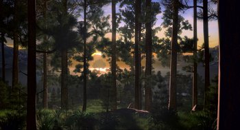 Movie still from “Crank” (2006), directed by Mark Neveldine – The sun is setting in the distance behind the trees; Extreme Wide shot, High angle