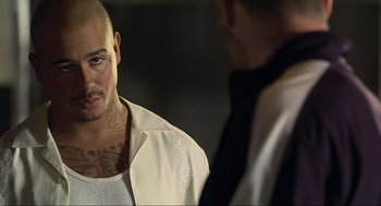 Movie still from “Crank” (2006), directed by Mark Neveldine – A man in a white shirt and a man in a black tie; Close Up shot, Over the shoulder angle