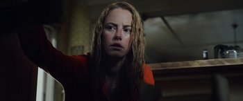 Movie still from “Crawl” (2019), directed by Alexandre Aja – A person with wet hair; Close Up shot, Low angle