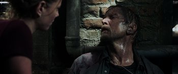 Movie still from “Crawl” (2019), directed by Alexandre Aja – A man and a woman are looking into each other's eyes; Close Up shot, Over the shoulder angle