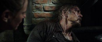 Movie still from “Crawl” (2019), directed by Alexandre Aja – A person wearing a jacket; Close Up shot, Overhead angle