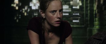 Movie still from “Crawl” (2019), directed by Alexandre Aja – A person sitting on the ground; Close Up shot, Low angle