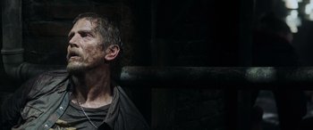 Movie still from “Crawl” (2019), directed by Alexandre Aja – A person wearing a black shirt; Close Up shot, Low angle