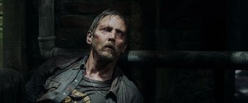 Movie still from “Crawl” (2019), directed by Alexandre Aja – A person wearing a shirt and jacket; Close Up shot, Low angle