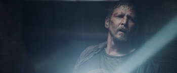 Movie still from “Crawl” (2019), directed by Alexandre Aja – A person with a bruise on his face; Close Up shot, Low angle