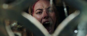 Movie still from “Crawl” (2019), directed by Alexandre Aja – A person with a knife in their hand; Close Up shot, Low angle