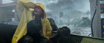 Movie still from “Crawl” (2019), directed by Alexandre Aja – A woman sitting in a boat on a rainy day; Medium shot, Low angle
