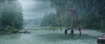 Movie still from “Crawl” (2019), directed by Alexandre Aja – A tire swing in the middle of a flooded park; Extreme Wide shot, High angle