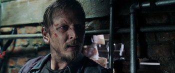 Movie still from “Crawl” (2019), directed by Alexandre Aja – A person with a beard; Close Up shot, Over the shoulder angle