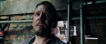 Movie still from “Crawl” (2019), directed by Alexandre Aja – A person with a beard; Close Up shot, Low angle