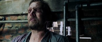 Movie still from “Crawl” (2019), directed by Alexandre Aja – A person with his eyes closed; Close Up shot, Low angle