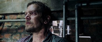 Movie still from “Crawl” (2019), directed by Alexandre Aja – A person with wet hair; Close Up shot, Low angle