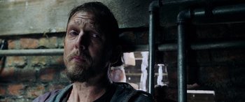 Movie still from “Crawl” (2019), directed by Alexandre Aja – A person with a beard; Close Up shot, Low angle