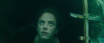 Movie still from “Crawl” (2019), directed by Alexandre Aja – A person looking up at the sky; Close Up shot, Overhead angle