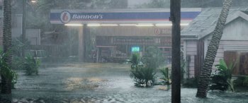 Movie still from “Crawl” (2019), directed by Alexandre Aja – A flooded street with a store and a plant in front of it; Extreme Wide shot, High angle
