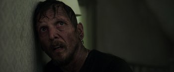 Movie still from “Crawl” (2019), directed by Alexandre Aja – A person with wet hair; Close Up shot, Over the shoulder angle