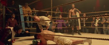 Movie still from “Creed” (2015), directed by Ryan Coogler – A group of people in a boxing ring; Wide shot, High angle