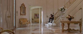 Movie still from “Creed” (2015), directed by Ryan Coogler – A man sitting on the steps of a staircase; Wide shot, Low angle