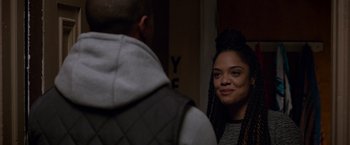 Movie still from “Creed” (2015), directed by Ryan Coogler – A young woman is looking at a man in the mirror; Close Up shot, Over the shoulder angle