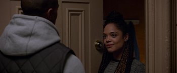 Movie still from “Creed” (2015), directed by Ryan Coogler – A woman standing in front of a door with a man; Close Up shot, Over the shoulder angle