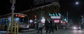 Movie still from “Creed” (2015), directed by Ryan Coogler – A group of people walking across a street at night; Extreme Wide shot, Low angle