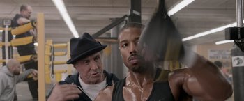 Movie still from “Creed” (2015), directed by Ryan Coogler – Sylvester stallone and michael b; Close Up shot, Over the shoulder angle