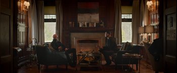Movie still from “Creed” (2015), directed by Ryan Coogler – Two men sitting in front of a fire place; Wide shot, Over the shoulder angle
