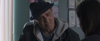Movie still from “Creed” (2015), directed by Ryan Coogler – An older man wearing a hat and a jacket; Close Up shot, Over the shoulder angle