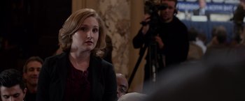 Movie still from “Creed” (2015), directed by Ryan Coogler – A woman is sitting in front of a camera; Close Up shot, Over the shoulder angle