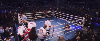 Movie still from “Creed” (2015), directed by Ryan Coogler – A group of men standing in the middle of a boxing ring; Extreme Wide shot, High angle