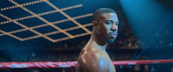 Movie still from “Creed II” (2018), directed by Steven Caple Jr. – A person in a boxing ring; Close Up shot, Over the shoulder angle