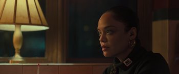 Movie still from “Creed II” (2018), directed by Steven Caple Jr. – A person wearing a shirt and tie; Close Up shot, Over the shoulder angle