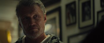 Movie still from “Creed II” (2018), directed by Steven Caple Jr. – An older man with gray hair stares into the camera; Close Up shot, Low angle