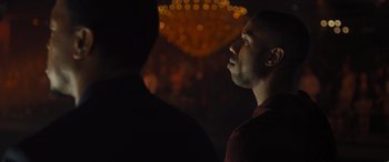 Movie still from “Creed II” (2018), directed by Steven Caple Jr. – A person looking up at the ceiling lights; Close Up shot, Over the shoulder angle