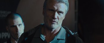 Movie still from “Creed II” (2018), directed by Steven Caple Jr. – A person wearing a shirt; Close Up shot, Low angle