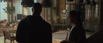 Movie still from “Creed II” (2018), directed by Steven Caple Jr. – A man and a woman standing in front of each other; Medium shot, Over the shoulder angle
