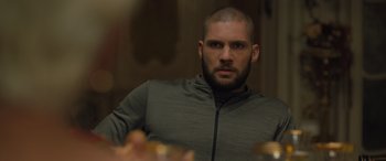 Movie still from “Creed II” (2018), directed by Steven Caple Jr. – A person wearing a jacket; Close Up shot, Over the shoulder angle