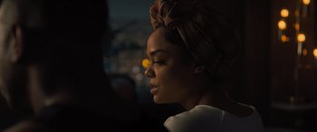 Movie still from “Creed II” (2018), directed by Steven Caple Jr. – A person wearing a headscarf; Close Up shot, Over the shoulder angle