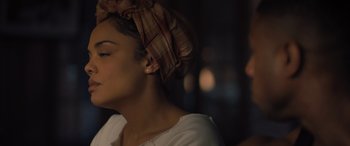 Movie still from “Creed II” (2018), directed by Steven Caple Jr. – A person wearing a head scarf; Close Up shot, Over the shoulder angle